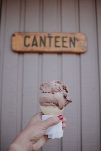 Close-up of hand holding ice cream cone