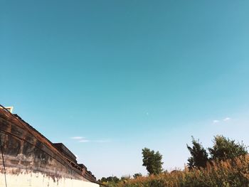 Low angle view of building against clear blue sky