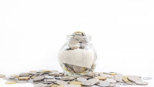 Close-up of coins on white background