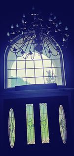 Low angle view of glass window against building