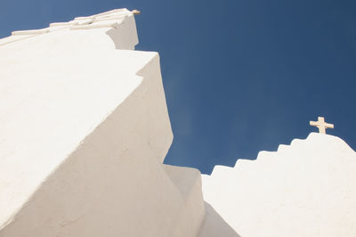 Low angle view of staircase against blue sky