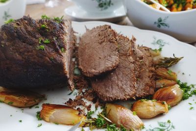 Close-up of meat loaf in plate on table at restaurant