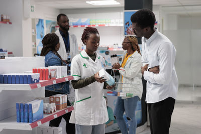 Side view of doctor examining x-ray at clinic