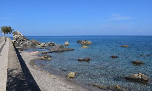 Scenic view of sea against clear blue sky