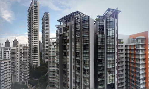 Skyscrapers in singapore  city against sky