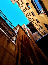 Low angle view of building against clear blue sky