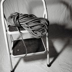 Close-up of rope tied on wooden table