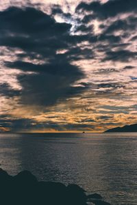 Scenic view of sea against dramatic sky