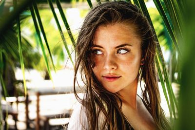 Close-up of young woman looking away