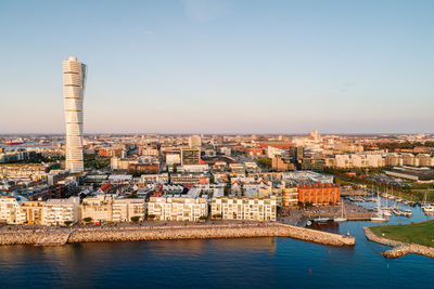 Scenic view of modern skyline in malmo city against clear sky