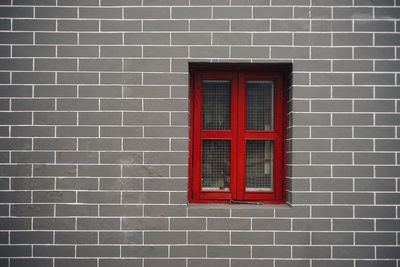 Close-up of window on brick wall