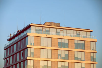 Low angle view of building against clear blue sky