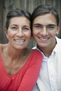 Portrait of mature woman with teenage son, sweden