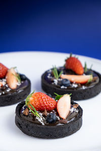 Close-up of strawberries in plate on table