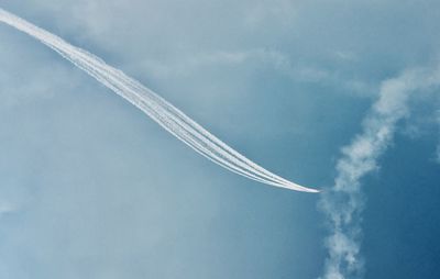 Airplane flying against sky