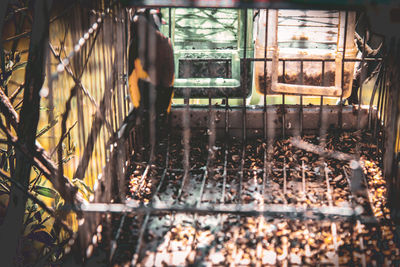 View of railroad tracks seen through window