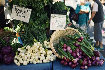 Spring onion at market stall for sale