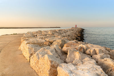 Beautiful summer sunset on the harbour breakwater. denia, alicante, spain