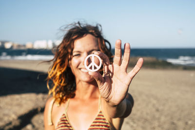 Portrait of beautiful young woman on beach