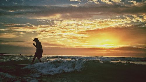 Scenic view of sea at sunset