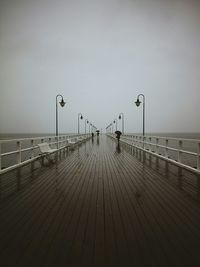 Pier on sea against sky