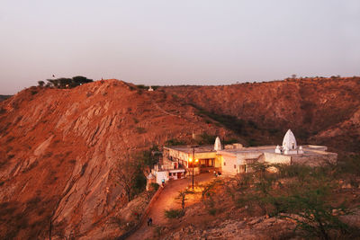 High angle view of temple on mountain against sky at dusk