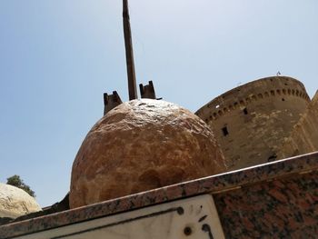 Low angle view of old building against clear sky