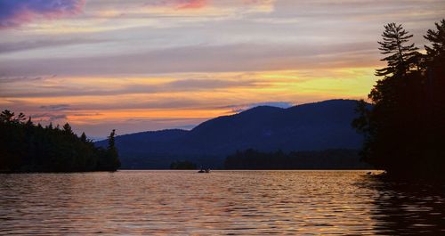 Scenic view of lake at sunset