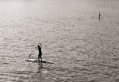 Woman jumping in sea