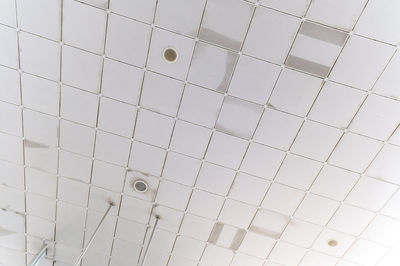 Fluorescent lamps on the modern ceiling. luminous ceiling of square tiles. interior idea concept.