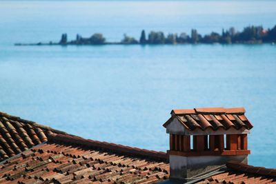 House by sea against sky