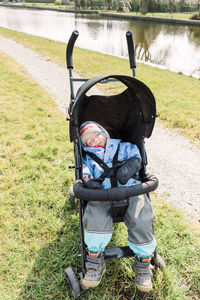 Close-up of girl sleeping in baby stroller