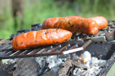 Close-up of sausages being grilled on barbecue