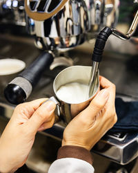 Cropped hand of man holding coffee