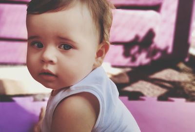 Close-up portrait of cute girl looking away