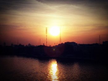 Scenic view of river at sunset
