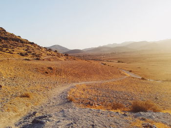 Scenic view of desert against clear sky in cabo de gata, almería, andalucia