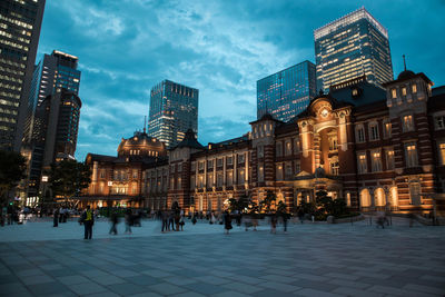 Buildings in city at night in tokyo. 