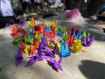 High angle view of multi colored paper bird on table