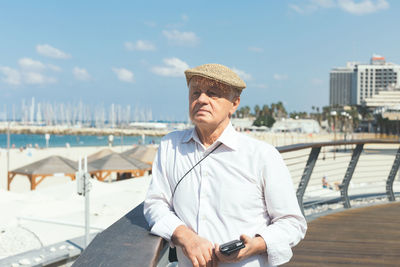 Full length of man standing against sea