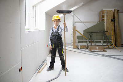 Low section of man standing in workshop