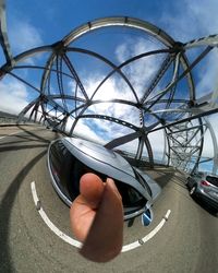 Close-up of cropped car against sky