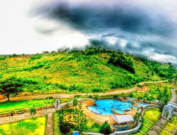 Scenic view of landscape against cloudy sky