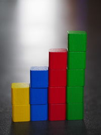 Stack of colorful toy blocks on table