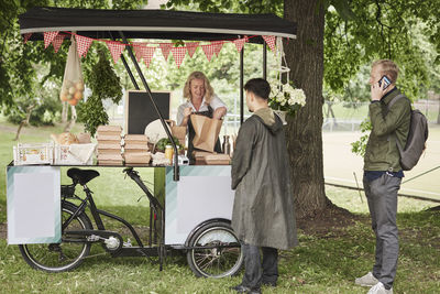 Clients buying food at food stall