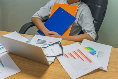 High angle view of man working on table