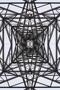 Low angle view of electricity pylon against sky