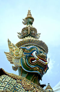 Low angle view of statue of temple against sky