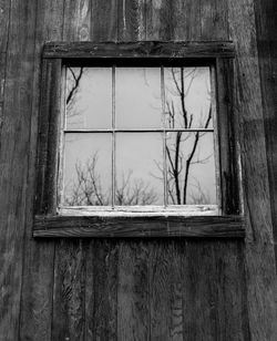 Close-up of broken window in abandoned building