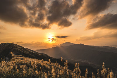 Scenic view of mountains against sky during sunset